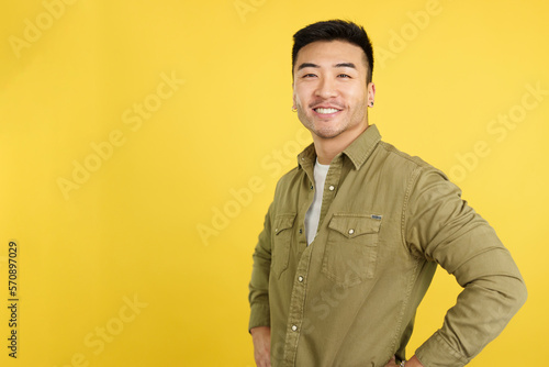 Handsome chinese man standing smiling at the camera