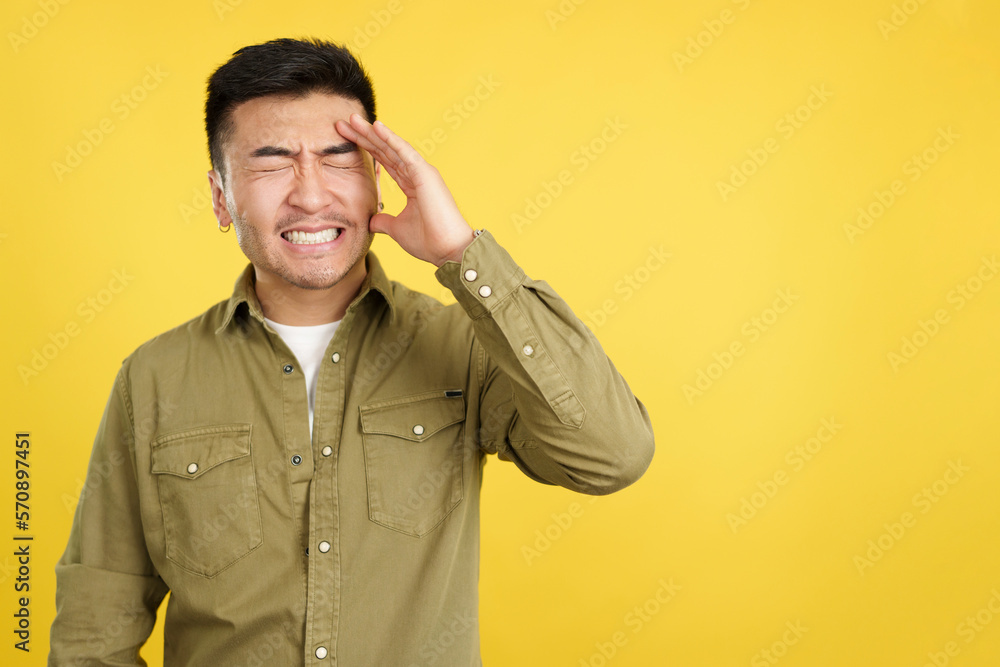 Chinese man gesturing that he is forgetting something Chinese man gesturing that he is forgetting something