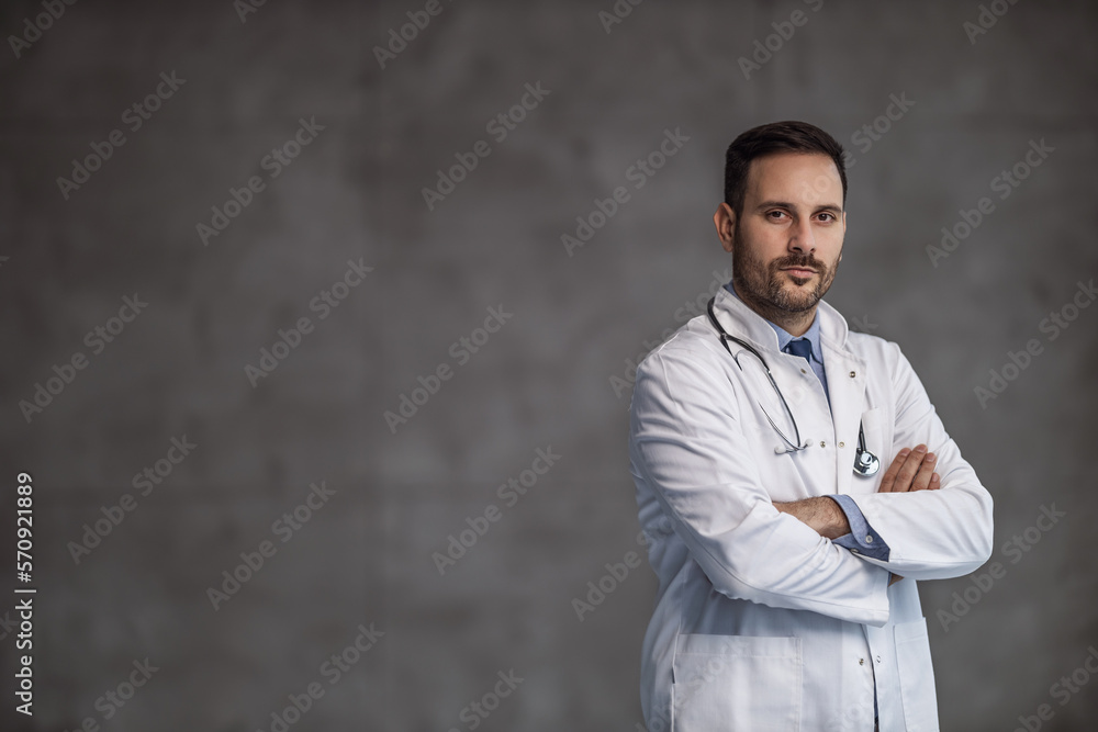Doctor standing and looking at camera -advertising your text or product Doctor standing and looking at camera -advertising your text or product