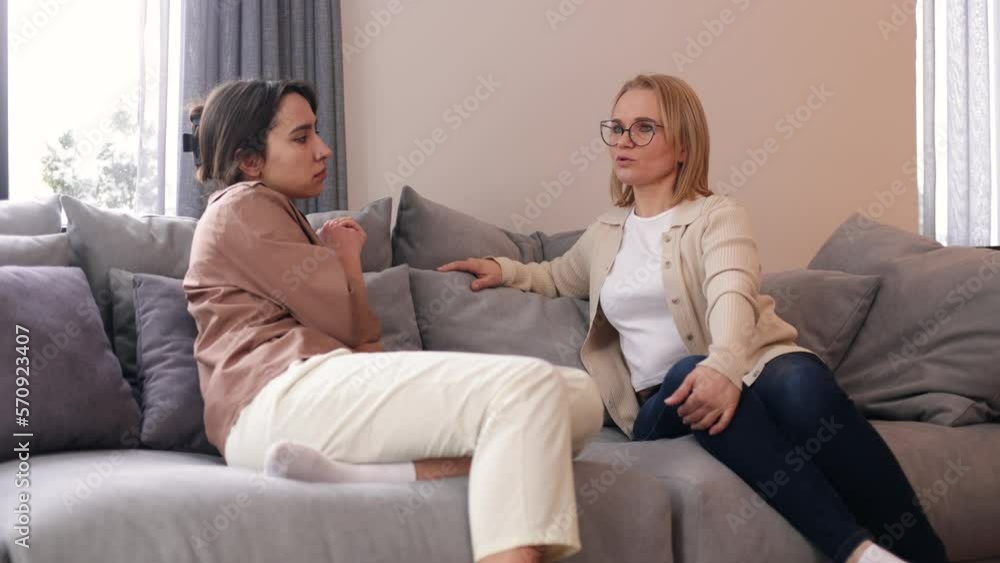 Sad frustrated woman talking in a session with a psychotherapist about her problems Sad frustrated woman talking in a session with a psychotherapist about her problems