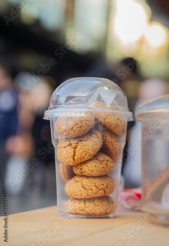 Belgrade, Serbia. February 11th, 2023. Brown cookies on a take away plastic cup. photo