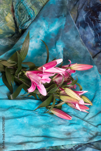 a bouquet of flowers is lying on the bed. Romance fragrant pink lilies