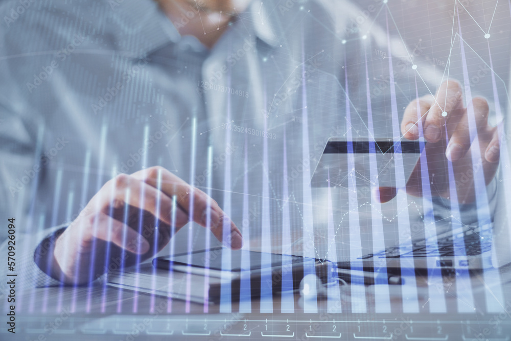 Double exposure of man hands holding a credit card and Forex graph drawing. Stock trading and digital fintech in Internet E-commerce concept. Double exposure of man hands holding a credit card and Forex graph drawing. Stock trading and digital fintech in Internet E-commerce concept.