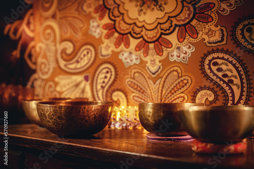 beautiful tibetan bowl on a wooden shelf  ceremonial space.
