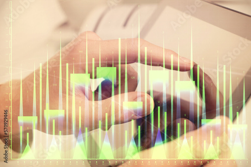 Multi exposure of man's hands holding and using a phone and financial chart drawing. Market analysis concept. © peshkova
