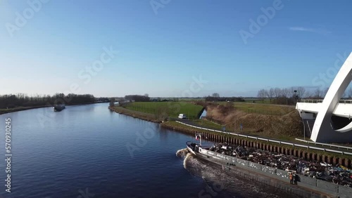 a ship in a canal with garbage from a drone height