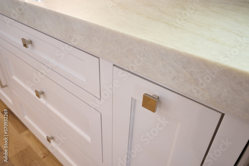 Gold hardware on white kitchen cabinets