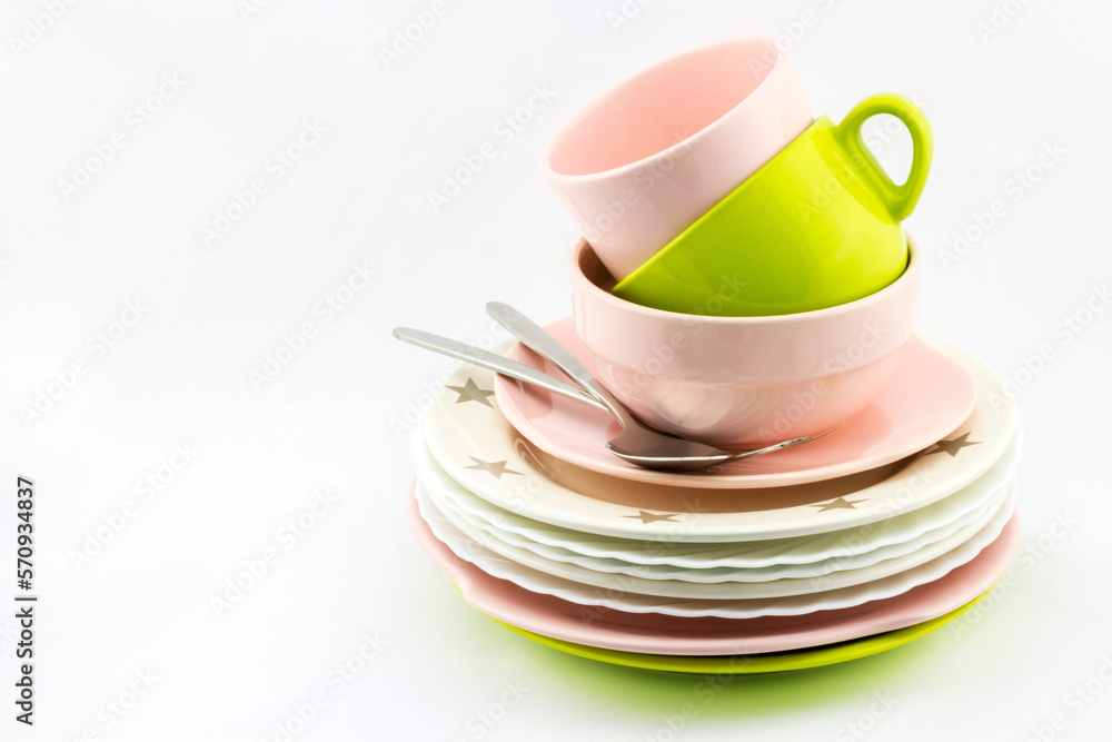 Tableware set of empty plates, bowls, fork and spoon on white background with place for your text