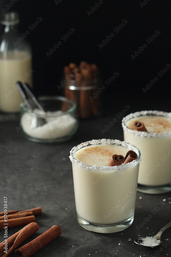 Two glasses with traditional Puerto Rico cocktail Coquito Two glasses with traditional Puerto Rico cocktail Coquito