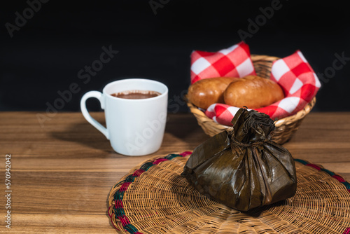 Typical Colombian Tamale with chocolate and bread, traditional colombian food, copy space photo