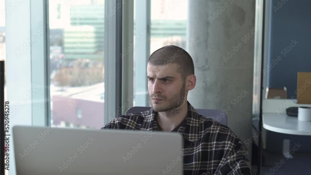 young guy studying working in a modern office young guy studying working in a modern office