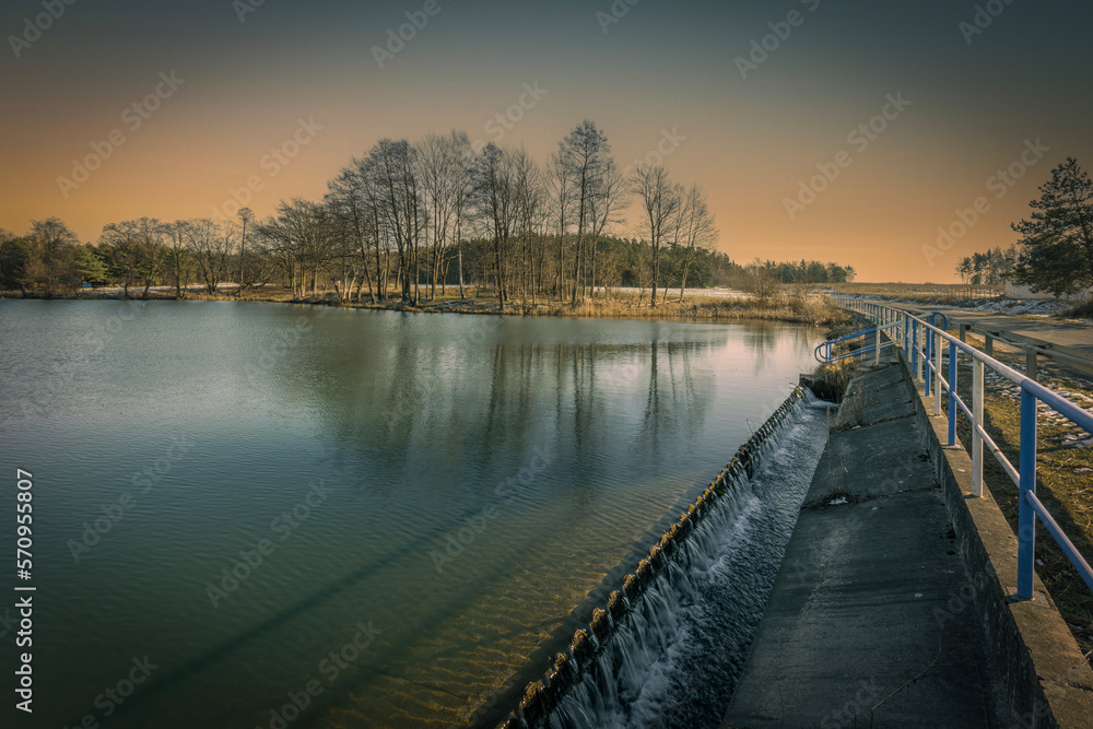 The end of winter, a small dam reservoir, a fishing ground in Poland.