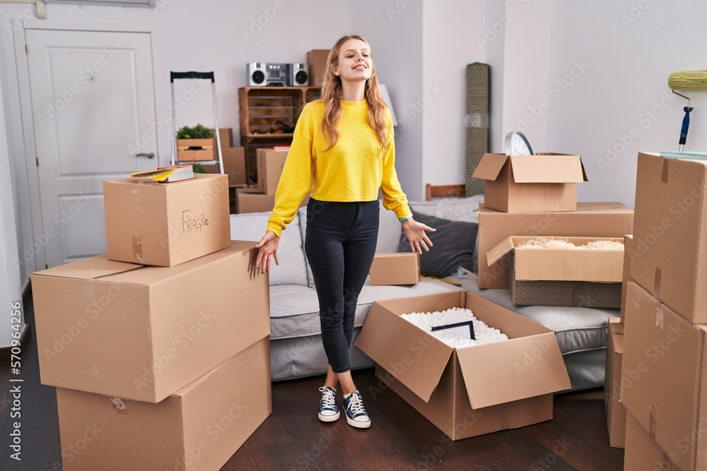 Young blonde woman smiling confident standing at new home Young blonde woman smiling confident standing at new home