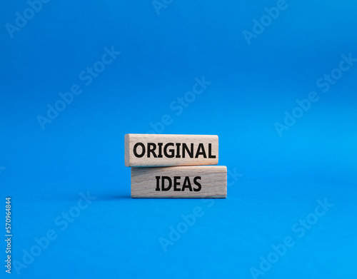 Original ideas symbol. Concept word Original ideas on wooden blocks. Beautiful blue background. Business and Original ideas concept. Copy space.