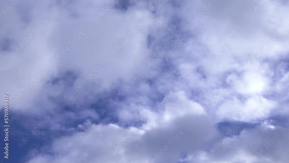 White fluffy cumulus clouds are flying, fast moving blue sky on a cloudy winter day. Blue sky white clouds. Cumulus cloud cloudscape timelapse. Fast moving white clouds and blue sky. White fluffy cumulus clouds are flying, fast moving blue sky on a cloudy winter day. Blue sky white clouds. Cumulus cloud cloudscape timelapse. Fast moving white clouds and blue sky.