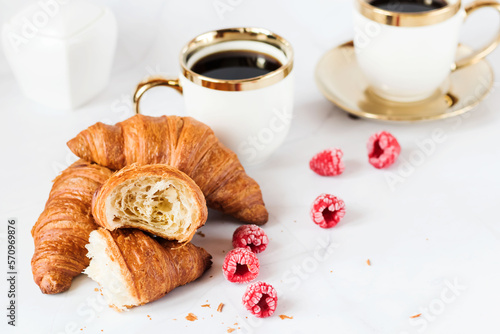 Morning with a cup of coffee and croissants. On a white background. Breakfast.