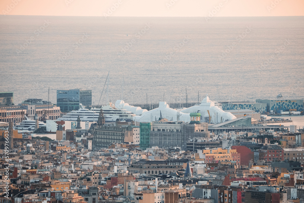 Aerial view of beautiful seascape and buildings at the Moll de Gregal del Port Olympic in Barcelona, Catalunya, Spain during sunset Aerial view of beautiful seascape and buildings at the Moll de Gregal del Port Olympic in Barcelona, Catalunya, Spain during sunset