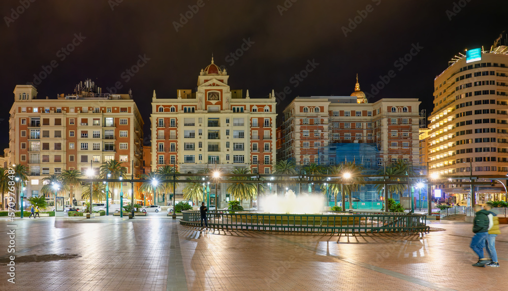 Night view of Marina Plaza square in the Mediterranean city of Malaga, Spain.