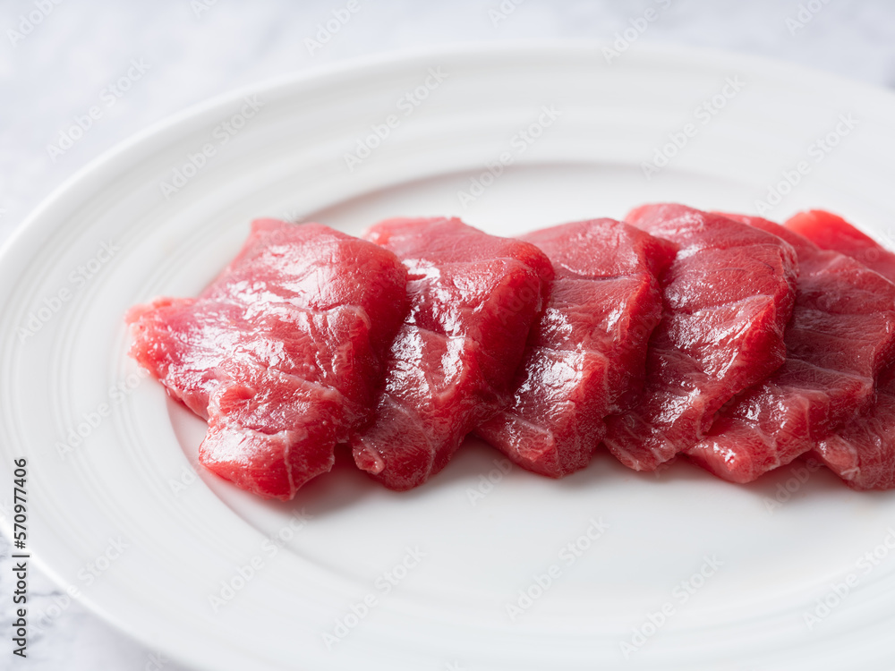 Fresh sliced raw tuna on plate Fresh sliced raw tuna on plate