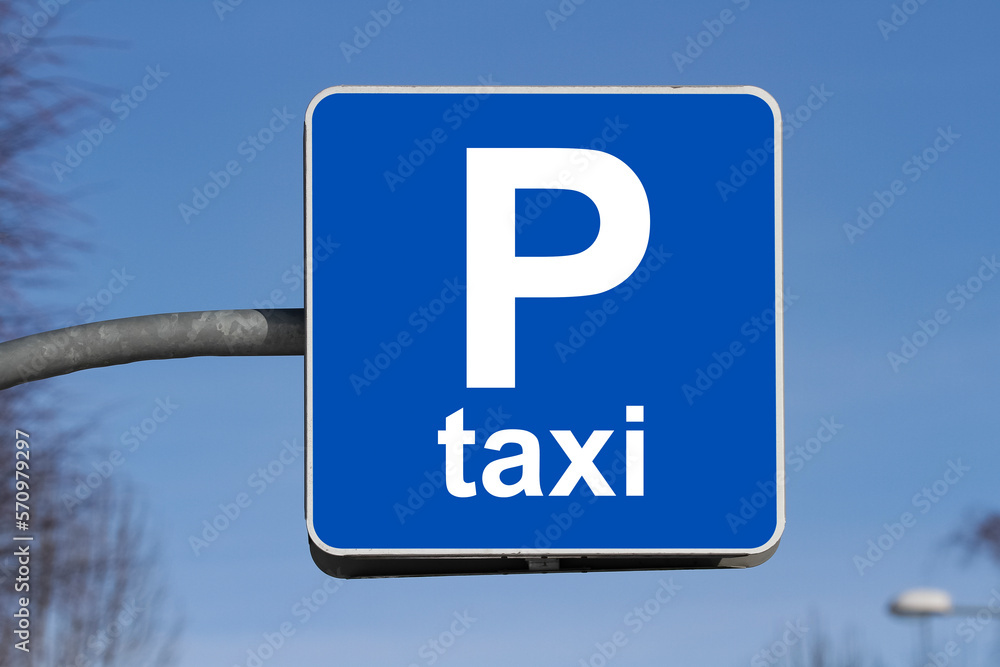 Taxi parking sign showing. Taxi parking sign with clean sky Taxi parking sign showing. Taxi parking sign with clean sky