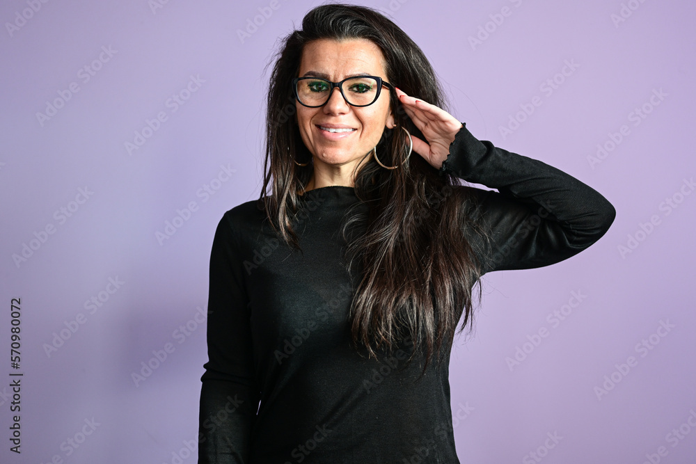 Beautiful smiling woman with eyeglasses looking at the phone , textint ,reading a Message ,checking social media using mobile phone app playing game, shopping online, ordering delivery Beautiful smiling woman with eyeglasses looking at the phone , textint ,reading a Message ,checking social media using mobile phone app playing game, shopping online, ordering delivery
