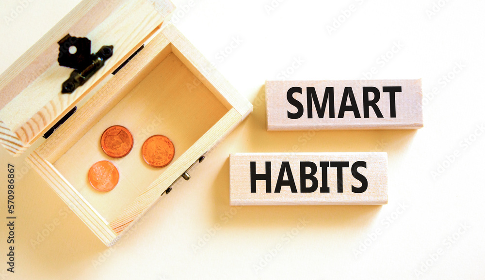 Smart habits symbol. Concept words Smart habits on wooden blocks. Beautiful white table white background. Wooden chest with coins. Business and smart habits concept. Copy space. Smart habits symbol. Concept words Smart habits on wooden blocks. Beautiful white table white background. Wooden chest with coins. Business and smart habits concept. Copy space.