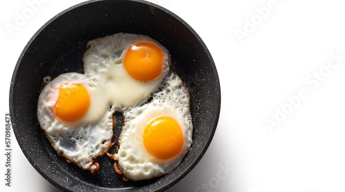 Frying pan with scrambled eggs from 3 eggs on a white background. isolate
