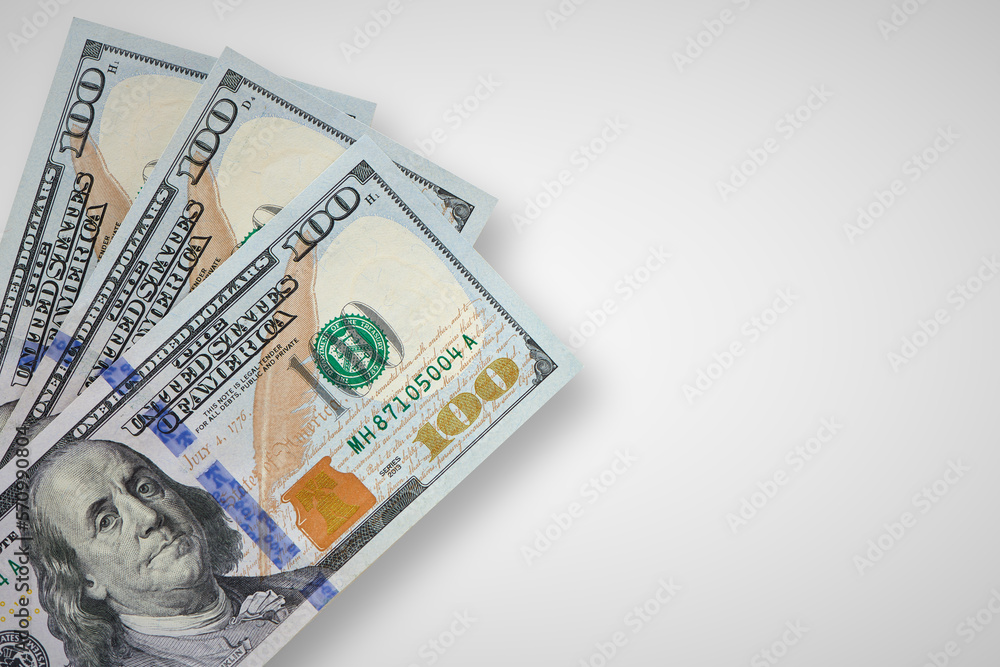 Several hundred us bills on table. Cash money. Currency background. Heap of dollar notes. Economy and finance concept. top view. Several hundred us bills on table. Cash money. Currency background. Heap of dollar notes. Economy and finance concept. top view.