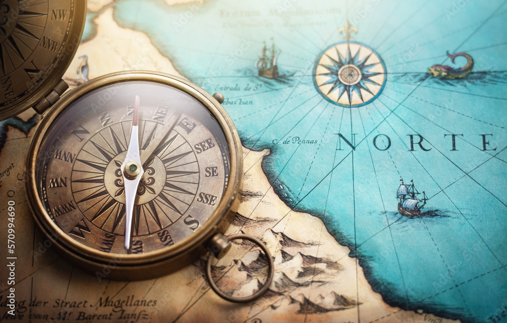 Magnetic old compass on world map.Travel, geography, navigation, tourism and exploration concept background. Treasure Island on the Pirate Map. - obrazy, fototapety, plakaty 