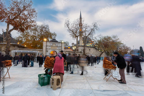 People are visiting Eyup Sultan Mosque and Tomb in Istanbul. Eyup is popular tourist attraction in Istanbul, Turkey. (Eyüp Sultan Cami) photo