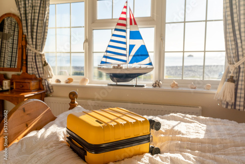 Suitcase or luggage bag in a classic old hotel room with sea view © Iryna