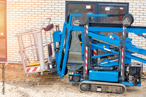 Blue mobile crawler elevating platform on building site