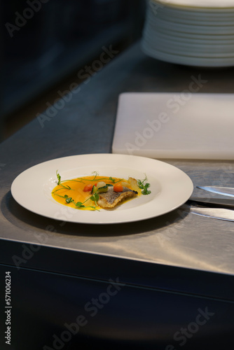 Sea bass appetizer on a white plate