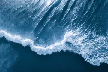 Spectacular aerial top view background photo of ocean sea water white wave splashing in the deep sea. Drone photo backdrop of sea wave in bird eye waves.