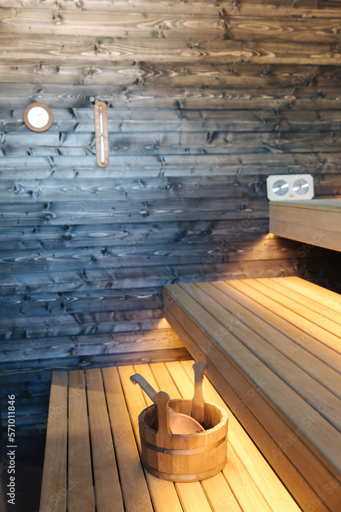 Interior of Finnish sauna. Front view of classic wooden sauna. Relax in