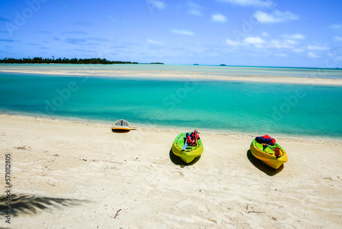 Kayaks on beach by tropical island lagoon