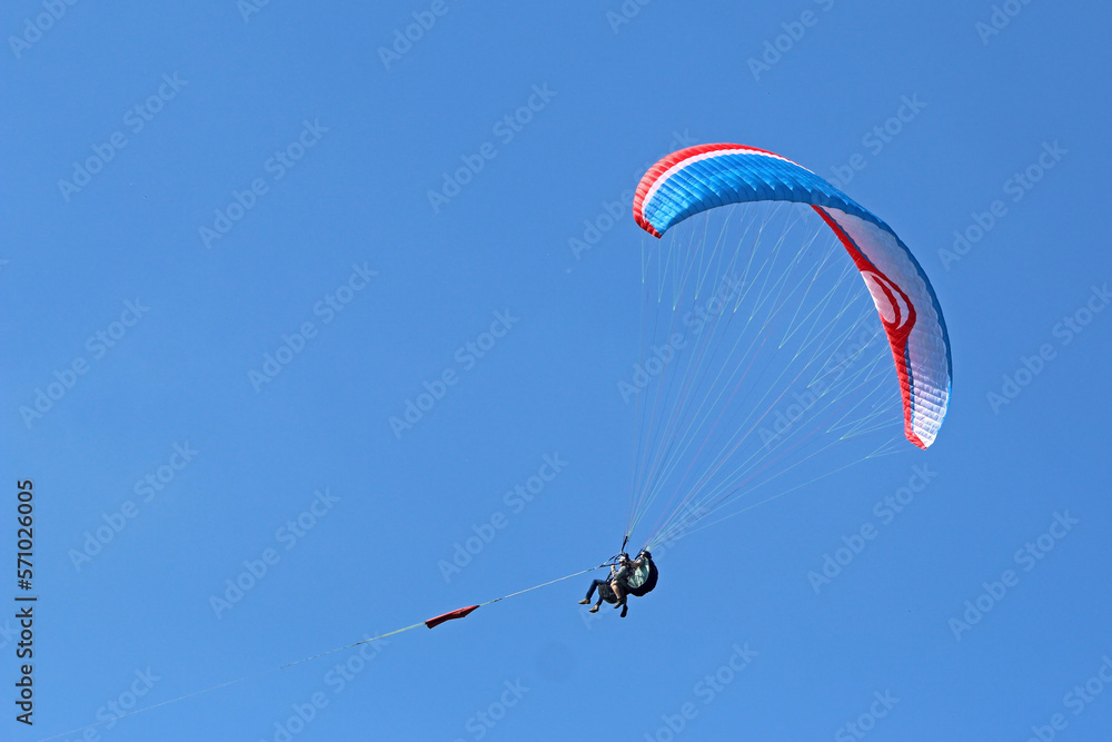 Tandem Paraglider being towed by a winch Tandem Paraglider being towed by a winch