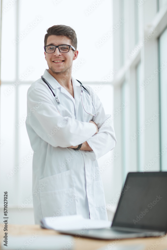 handsome young doctor portrait in medical office handsome young doctor portrait in medical office