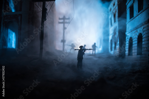 Military soldier silhouette with bazooka. War Concept. Military silhouettes fighting scene on war fog sky background  Soldier Silhouette aiming to the target at night. Attack scene