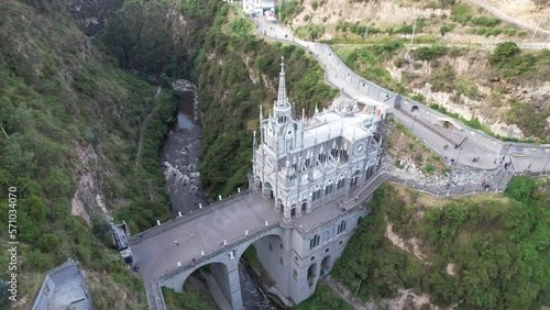 Drone view of the National Shrine Basilica of Our Lady of Las Lajas over the Guáitara River in Narino Department of Colombia in Ipiales, considered one of the most beautiful churches in the world photo