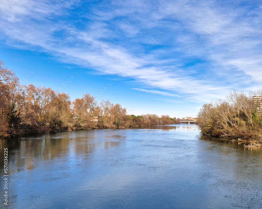A Mesmerizing View of the Garonne River Gracefully Passing Through the Enchanting City of Toulouse, Embracing the Urban Landscape with Serenity and Reflecting the City's Charms in its Gentle Waters A Mesmerizing View of the Garonne River Gracefully Passing Through the Enchanting City of Toulouse, Embracing the Urban Landscape with Serenity and Reflecting the City's Charms in its Gentle Waters