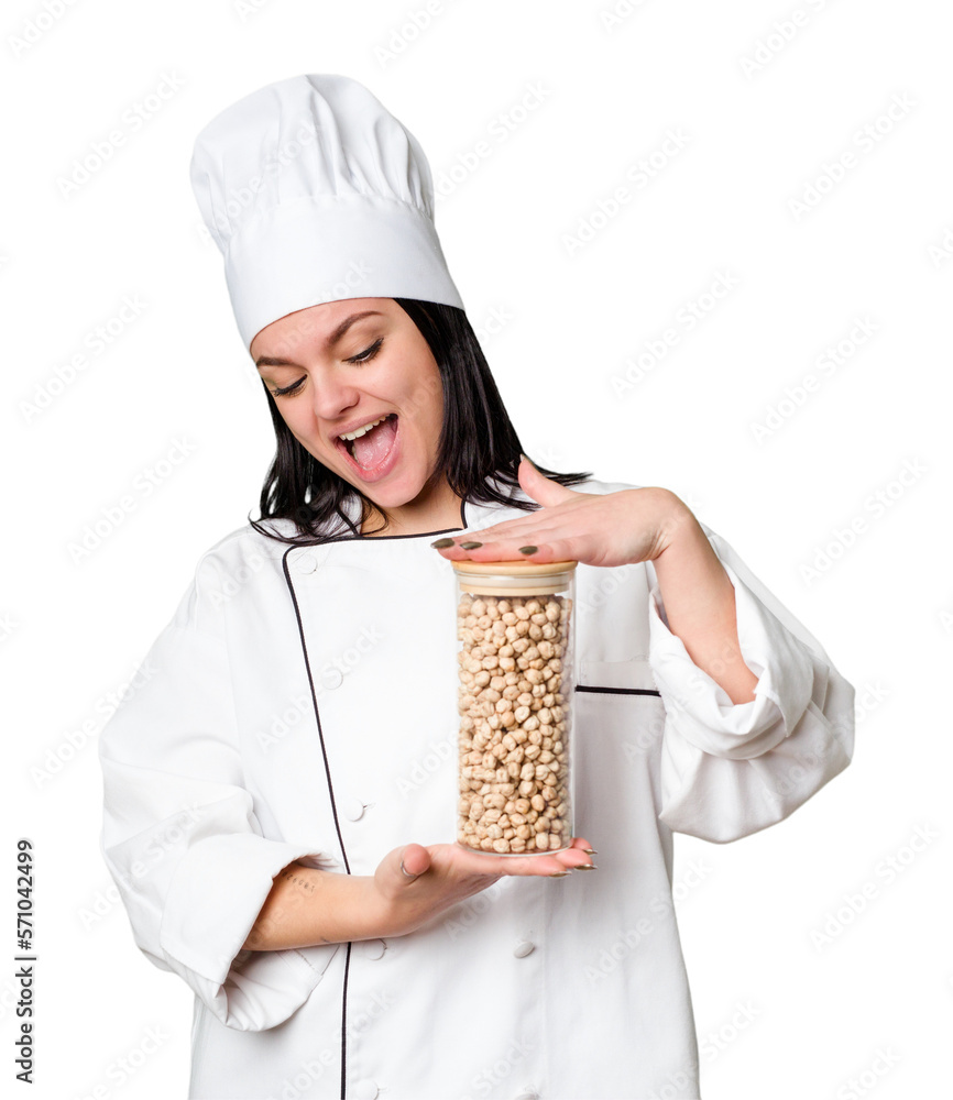 Young cook woman holding chickpeas isolated Young cook woman holding chickpeas isolated