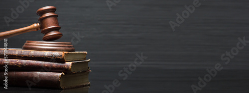 Law and justice concept. Mallet gavel of the judge, scales of justice, books. Copy space for text