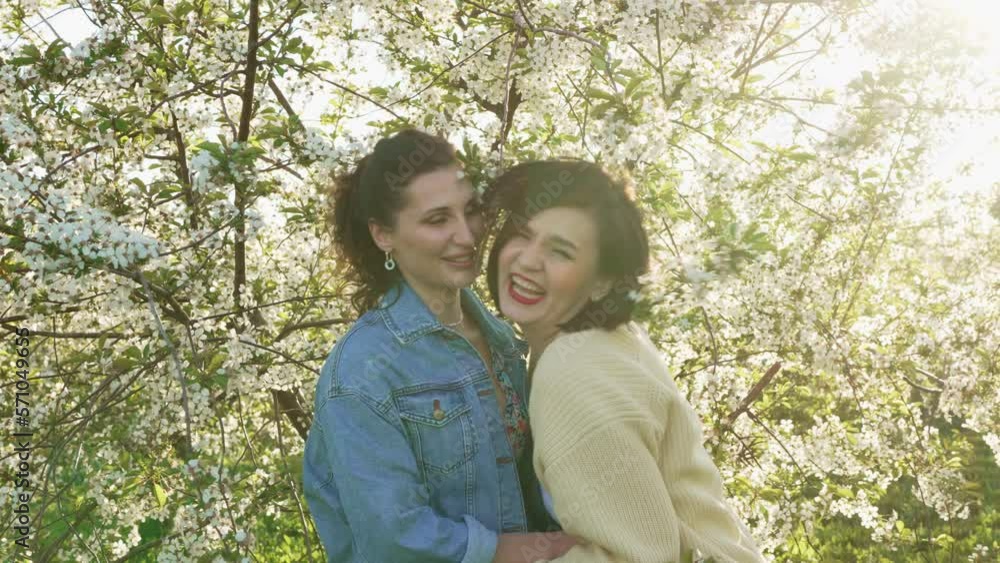 two attractive women in a spring garden. two attractive women in a spring garden.