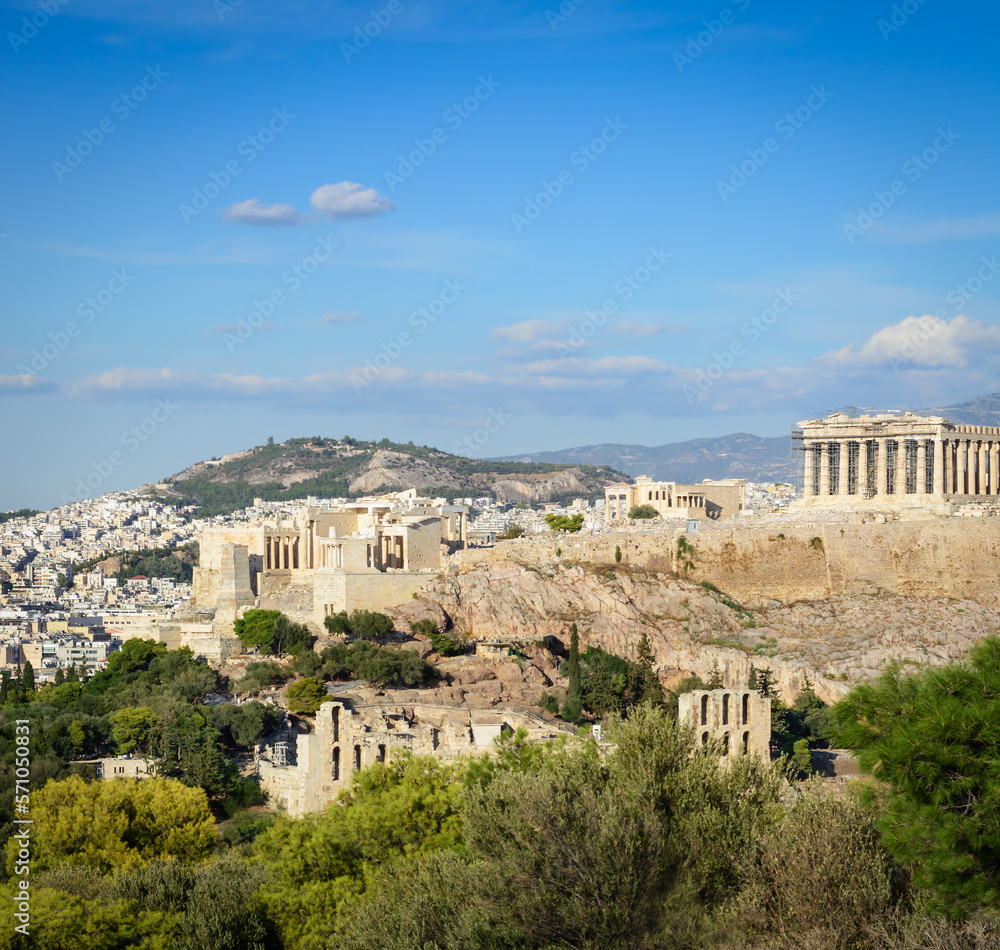 View of the Acropolis, Propylaea, Parthenon in the distance against the background a blue sky