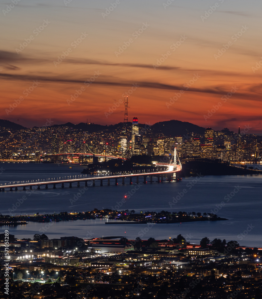 Aerial view of the Bay Bridge leading into San Francisco at sunset