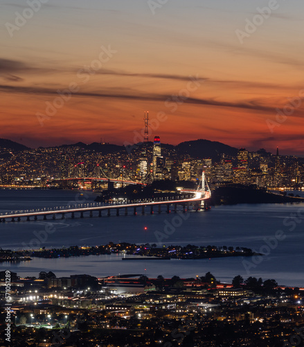 Aerial view of the Bay Bridge leading into San Francisco at sunset
