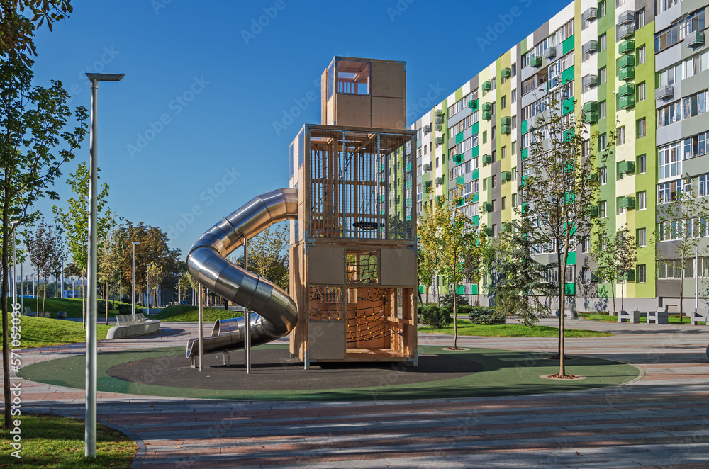 Childrens playground with tower in courtyard of multistorey building Childrens playground with tower in courtyard of multistorey building
