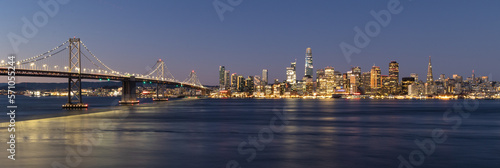 View of the Bay Bridge and San Francisco skyline at dawn from Treasure Island © James