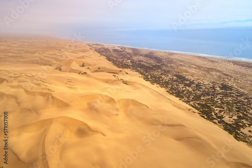 Aerial view of spectacular coastal dunes along namibian sea coast. Travelling Dorob National Park in Erongo, Namibia.